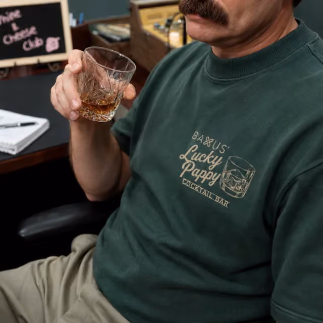 Bottle-green sweatshirt with a gold chest embroidery